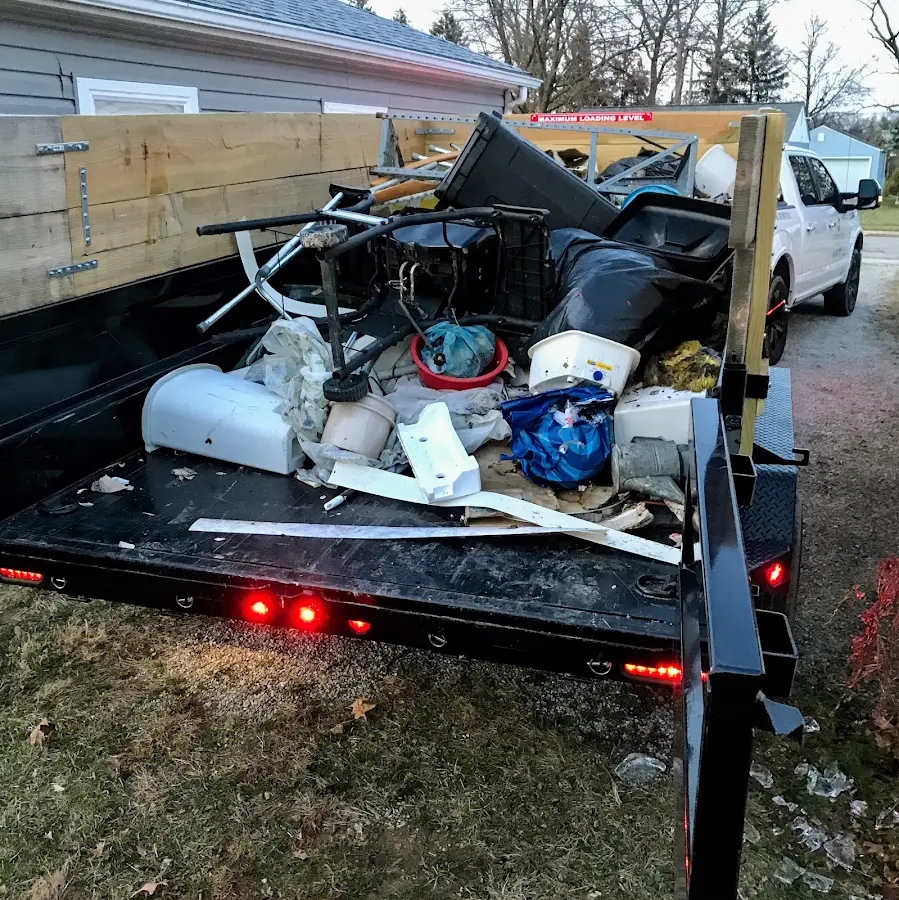 Roll-off dumpster delivered to a residential driveway in Laurel Hill